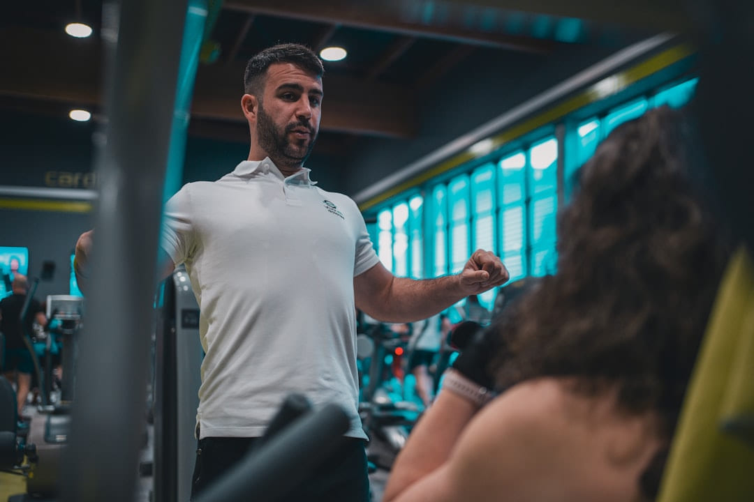 A man in a white shirt is in a gym on First Rep Forward