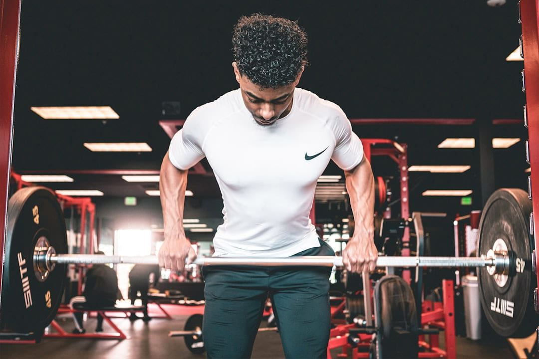 a man lifting weights on First Rep Forward