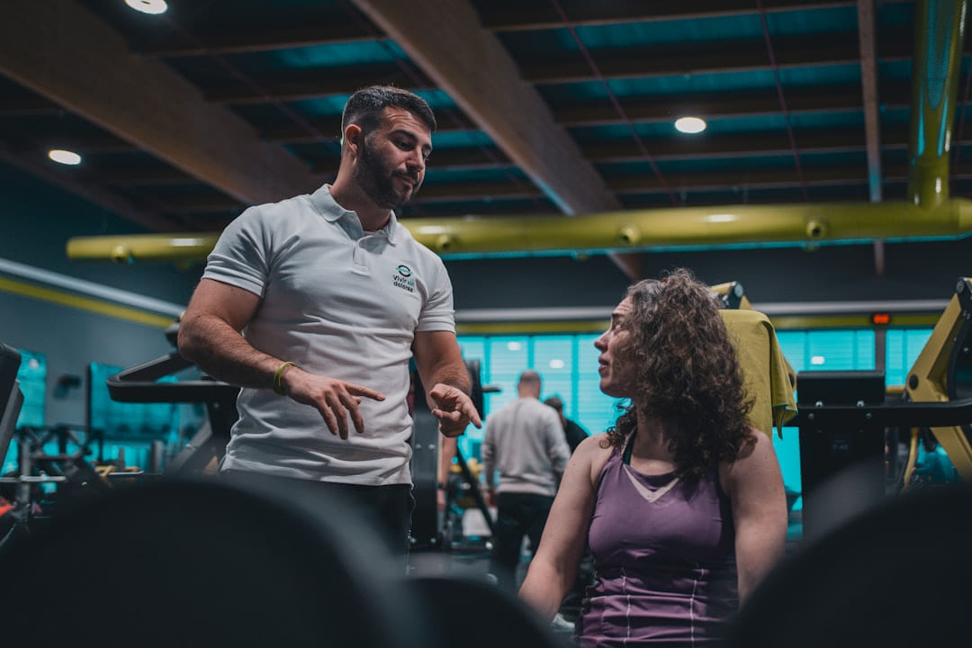 A man talking to a woman in a gym on First Rep Forward