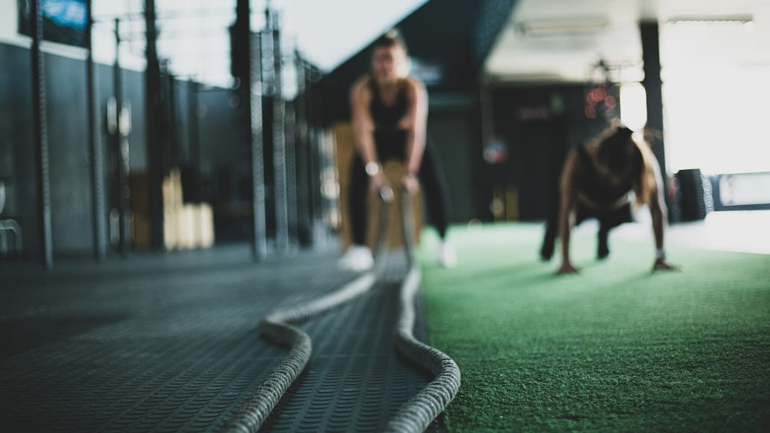 two person inside gym exercising on First Rep Forward