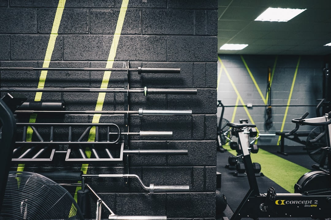 a gym with a wall of exercise equipment on First Rep Forward