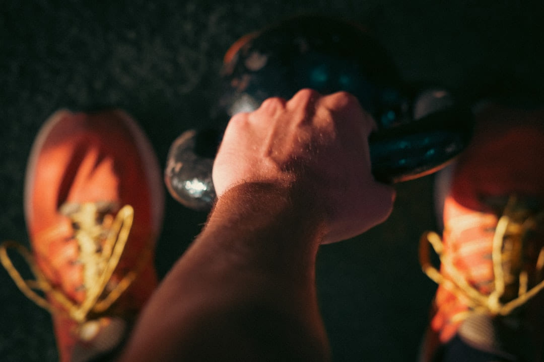 a close-up of a hand holding a light bulb on First Rep Forward