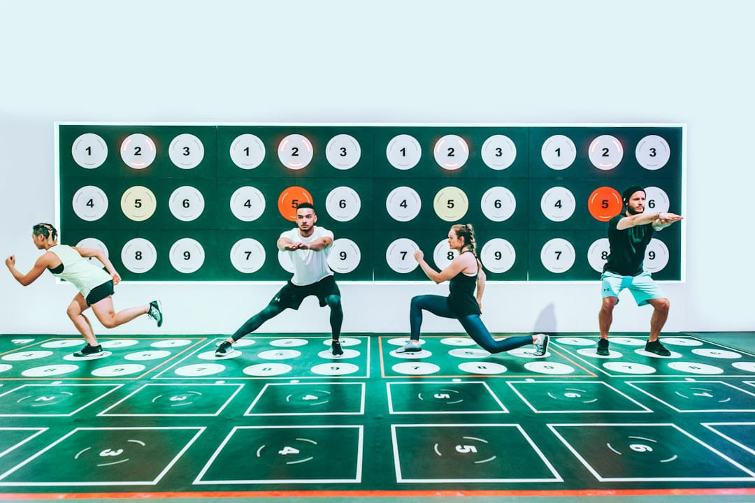 three men and woman doing exercises on First Rep Forward
